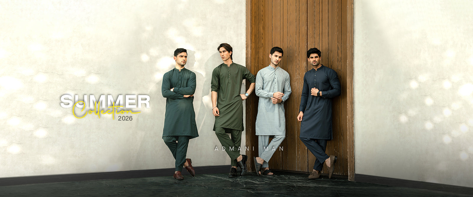 Admani Man Summer Collection 2026 banner featuring four models in navy blue, olive green, and gray shalwar kameez designs - premium menswear shalwar kameez with breathable unstitched fabric Pakistan by Admani Menswear