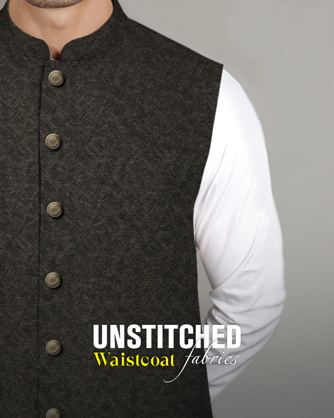 Admani premium unstitched menswear waistcoat fabric in a dark textured patterned weave paired with a white shalwar kameez.